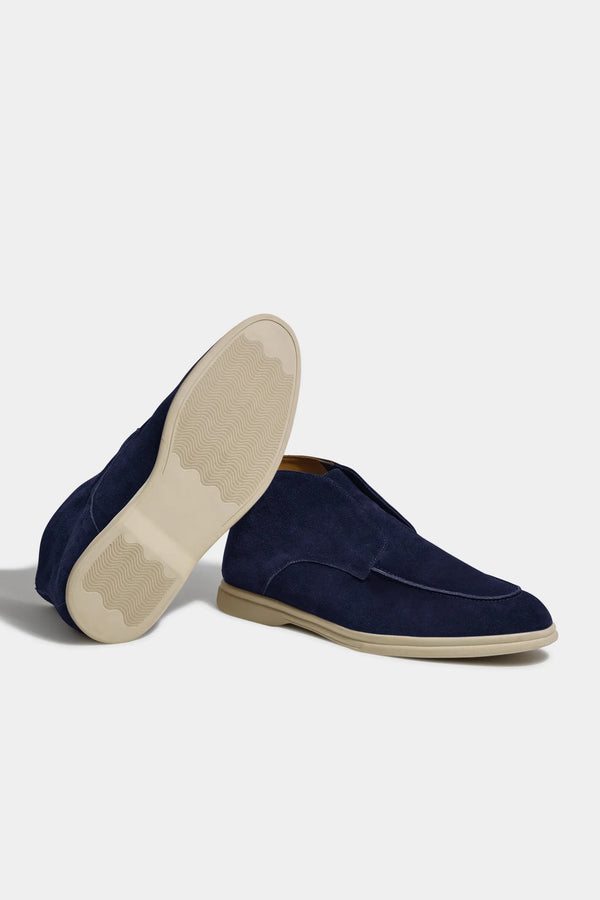 blue polacchino, men suede polacchino, italian suede loafers, blue suede loafers, slip-on suede boot, mid-top suede shoe, made in italy polacchino, luxury suede polacchino, elegant suede footwear, refined italian polacchino, premium suede loafers, soft suede ankle boot, versatile suede shoe, handcrafted italian footwear, timeless polacchino design, comfortable suede loafers, upscale suede shoe, italian craftsmanship polacchino, casual luxury footwear, classic blue suede loafer