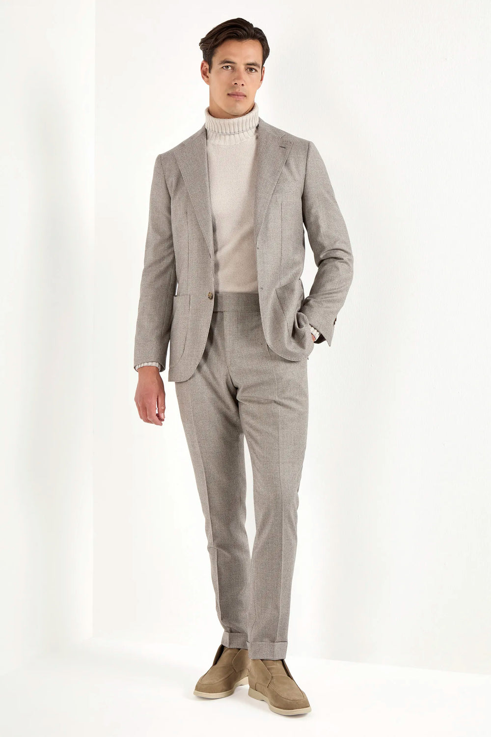 Taupe houndstooth suit, Italian style, made in Italy, tailored luxury suit, elegant menswear suit, refined formalwear, premium Italian craftsmanship, classic houndstooth weave suit, sophisticated business suit, smart formal attire, versatile modern suit, polished two-piece suit, fine Italian tailoring, upscale menswear suit, timeless Italian suit, refined professional look, sharp tailored suit, luxury office suit, contemporary houndstooth blazer, Italian elegance suit
