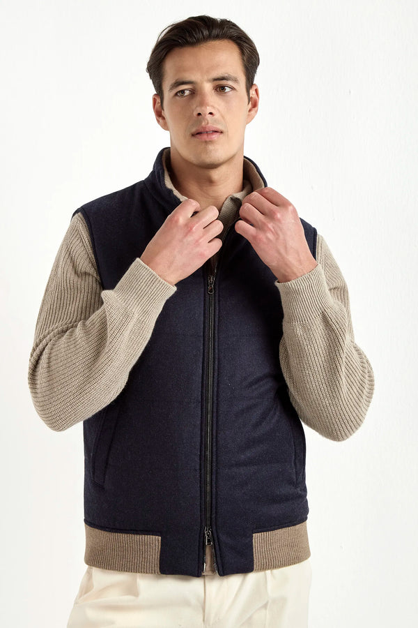 blue down vest, men's wool vest, italian cashmere vest, blue padded vest, luxury men's vest, elegant men's outerwear, refined wool vest, tailored blue vest, premium italian vest, sophisticated men's gilet, timeless italian outerwear, upscale men's vest, classic blue vest, italian craftsmanship vest, premium men's down vest, refined italian wool vest