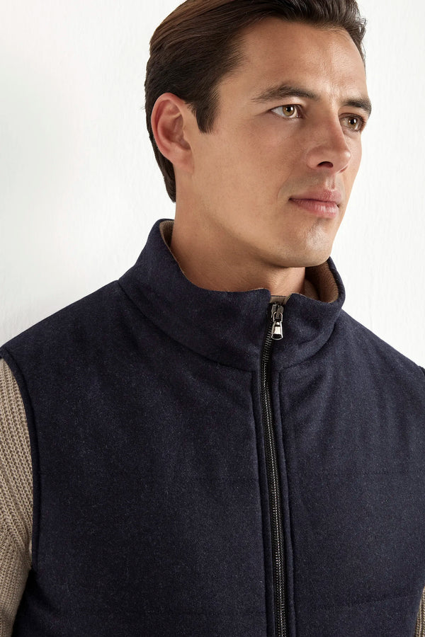 blue down vest, men's wool vest, italian cashmere vest, blue padded vest, luxury men's vest, elegant men's outerwear, refined wool vest, tailored blue vest, premium italian vest, sophisticated men's gilet, timeless italian outerwear, upscale men's vest, classic blue vest, italian craftsmanship vest, premium men's down vest, refined italian wool vest