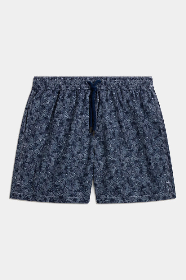 Blue patterned swimshorts on a white background