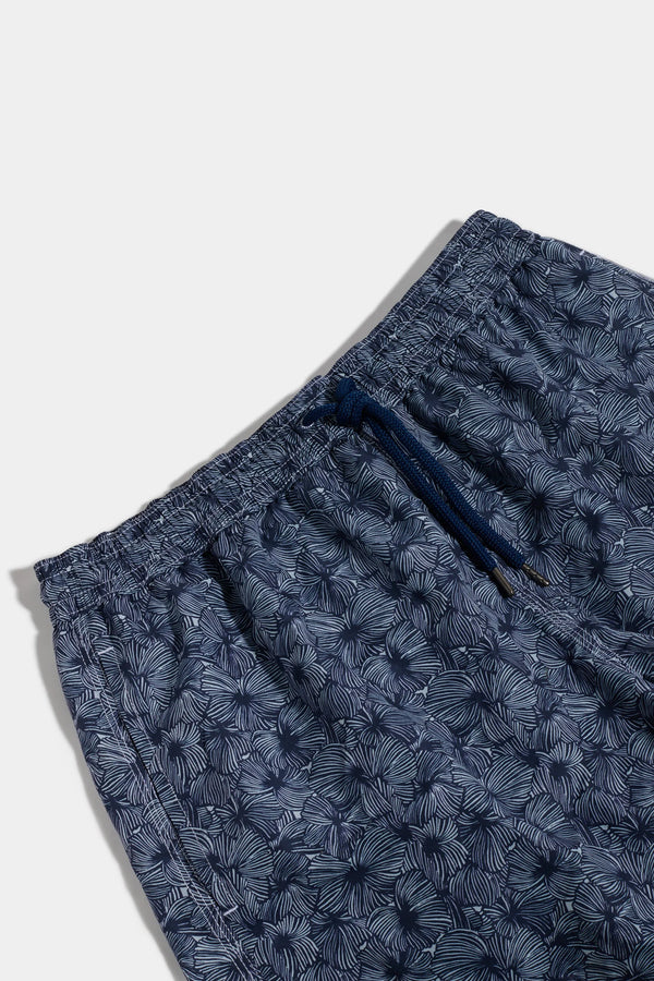 Navy blue shorts with a subtle pattern on a white background