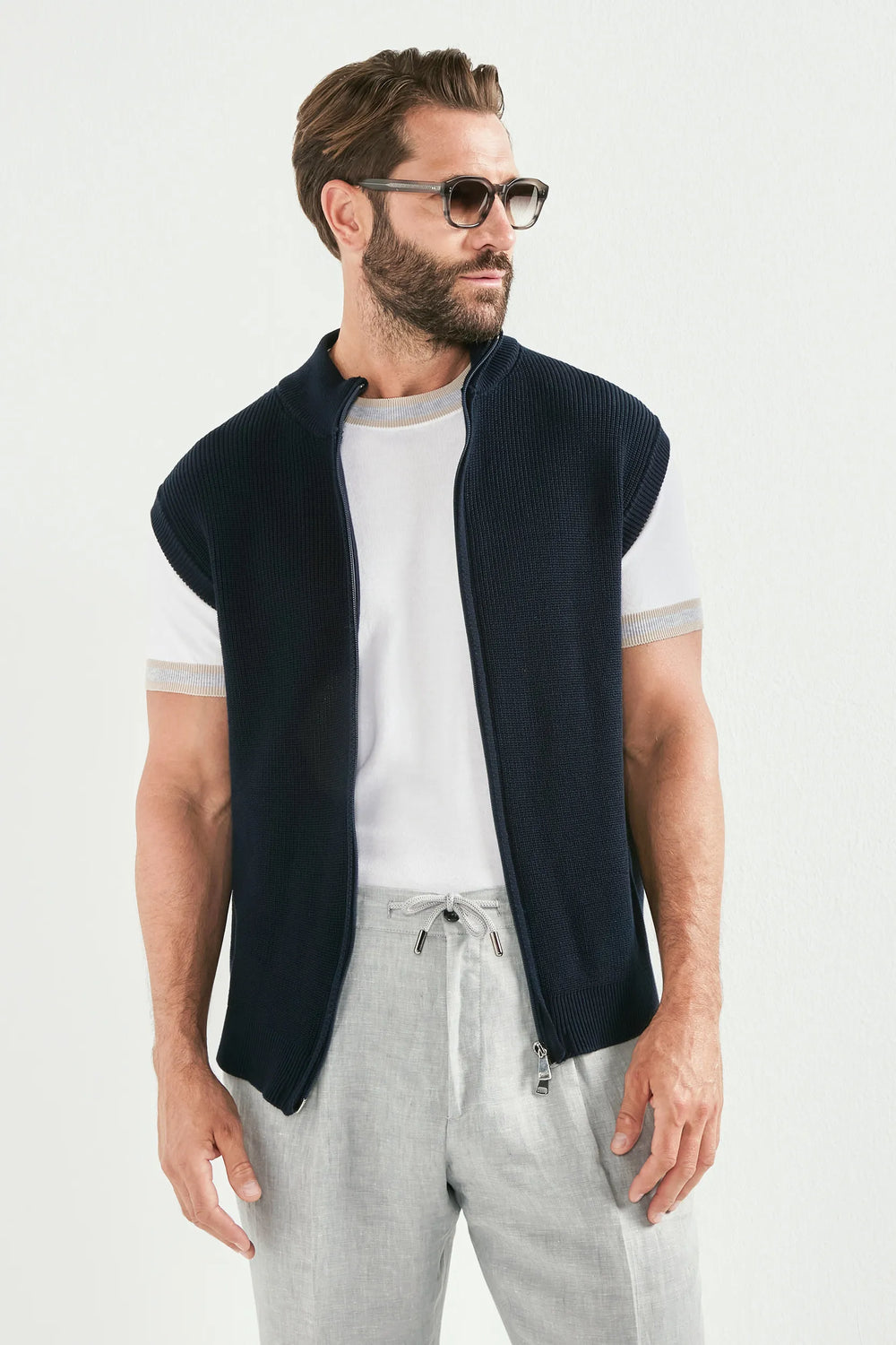 blue knitted vest, men's blue vest, italian knit vest, blue sleeveless knit, luxury men's vest, elegant men's knitwear, refined knitted vest, tailored blue vest, premium italian vest, sophisticated men's knitwear, timeless italian vest, upscale men's sleeveless knit, classic blue vest, italian craftsmanship knit, premium men's knitted vest, refined italian knitwear