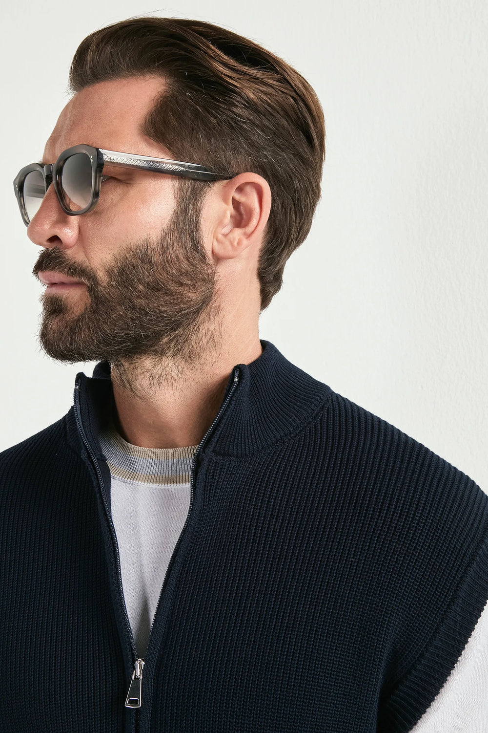blue knitted vest, men's blue vest, italian knit vest, blue sleeveless knit, luxury men's vest, elegant men's knitwear, refined knitted vest, tailored blue vest, premium italian vest, sophisticated men's knitwear, timeless italian vest, upscale men's sleeveless knit, classic blue vest, italian craftsmanship knit, premium men's knitted vest, refined italian knitwear
