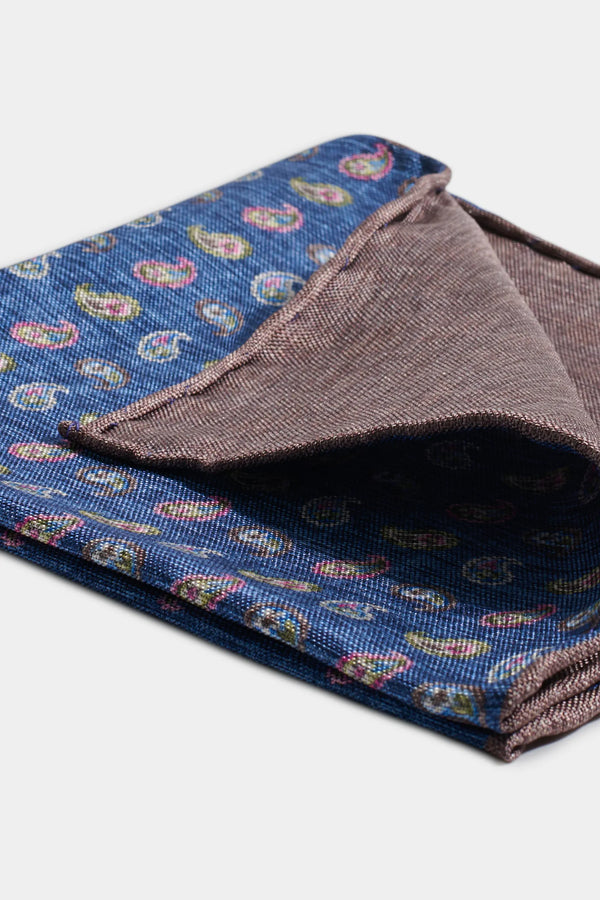 Folded fabric with paisley pattern on a white background