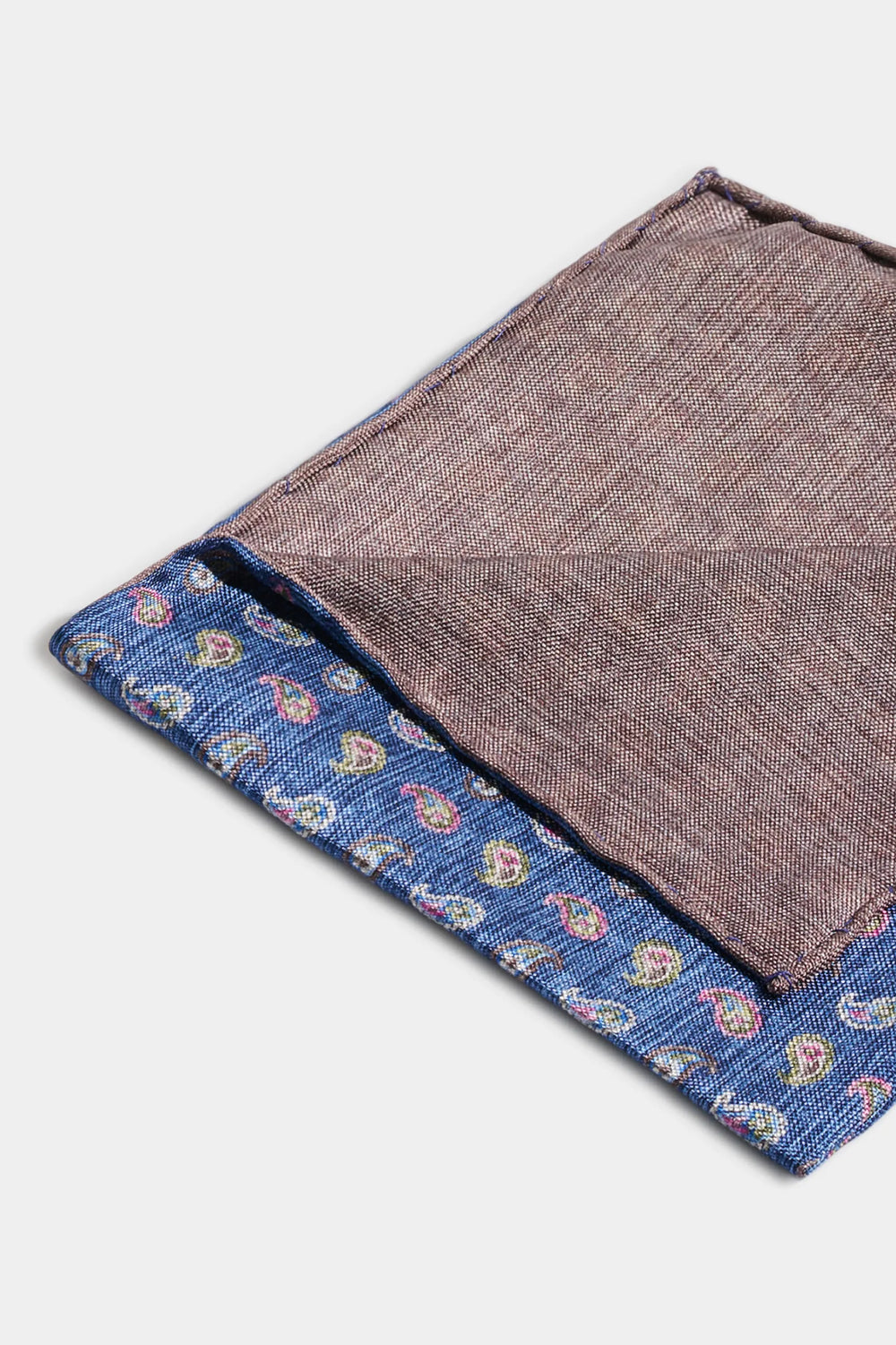Brown fabric with a blue border featuring floral patterns on a white background