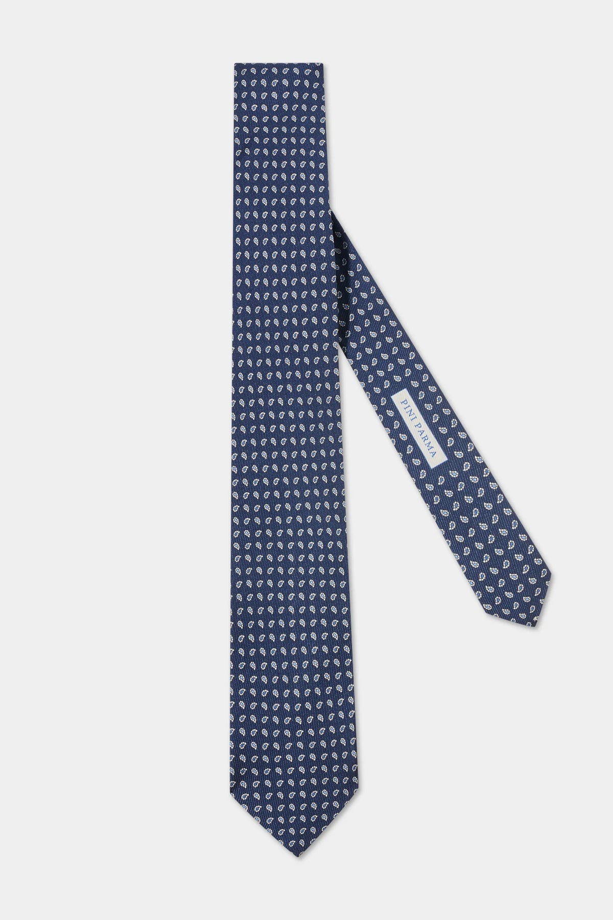 Navy blue patterned tie on a light gray background