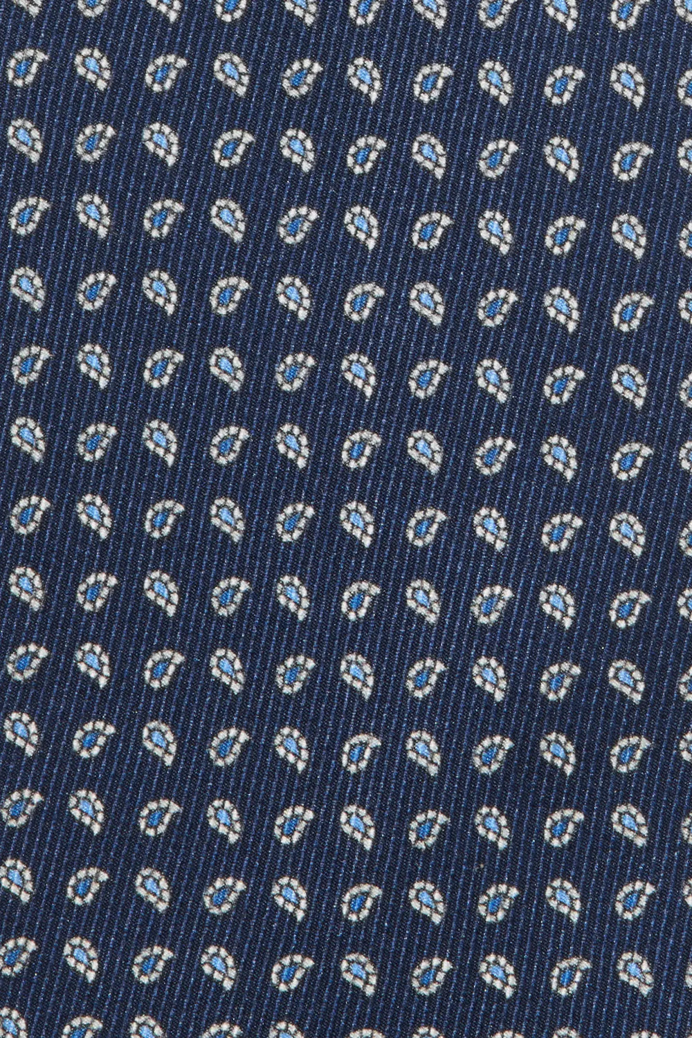 Close-up of a blue fabric with a small pattern
