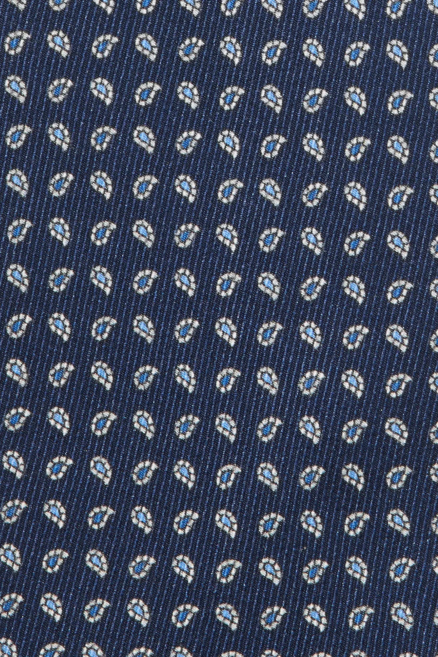 Close-up of a blue fabric with a small pattern