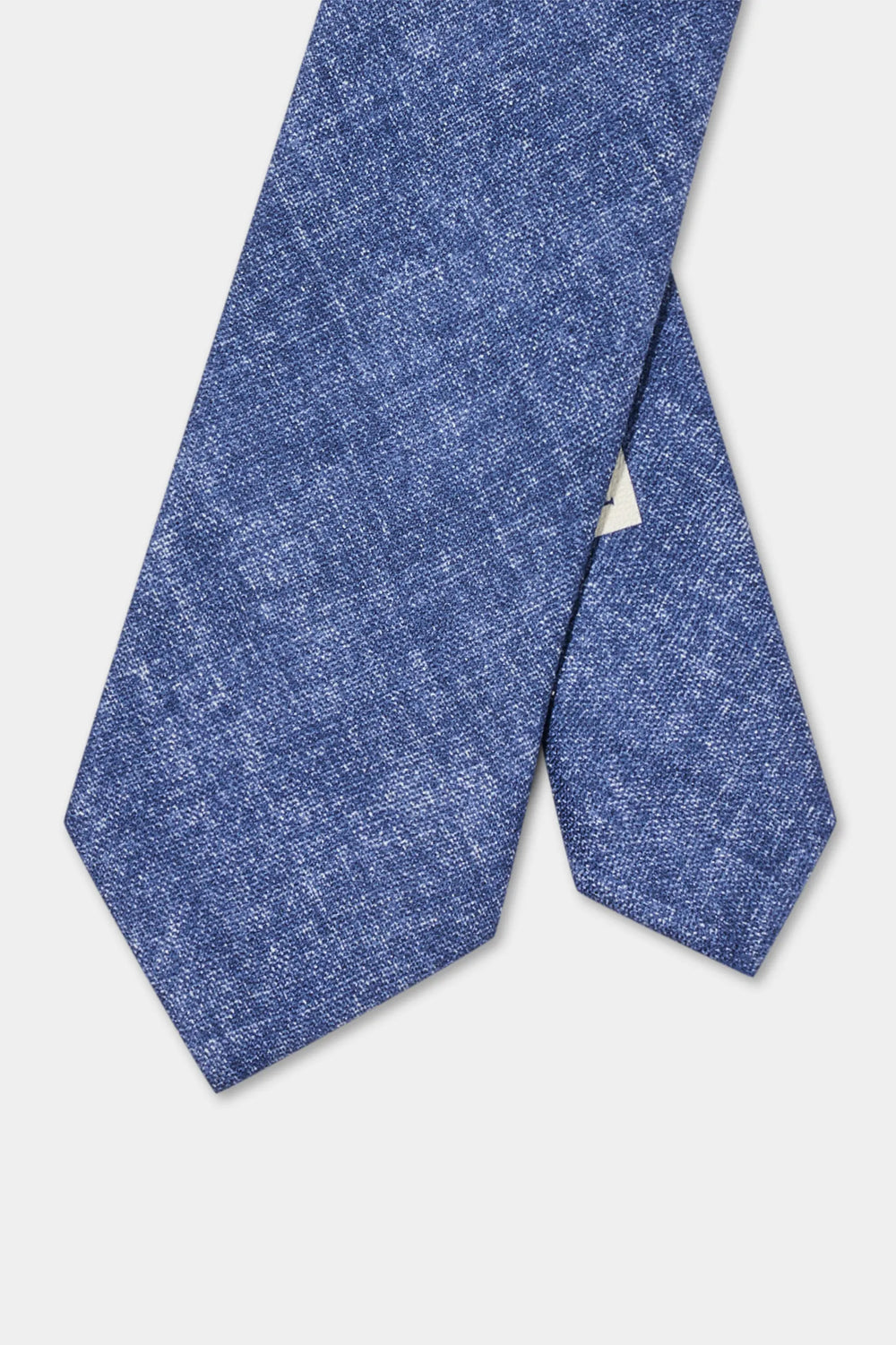 Blue textured tie on a light gray background