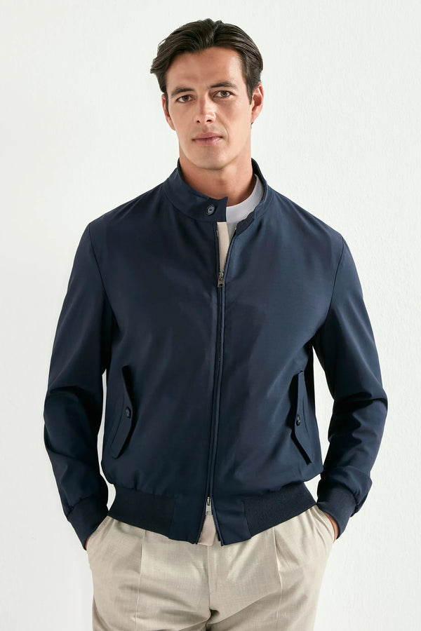 Man wearing a navy blue jacket on a white background