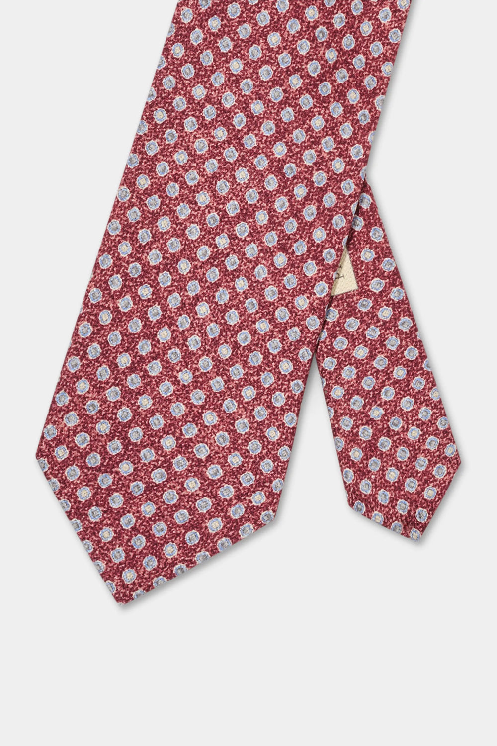 Red floral patterned tie on a light gray background
