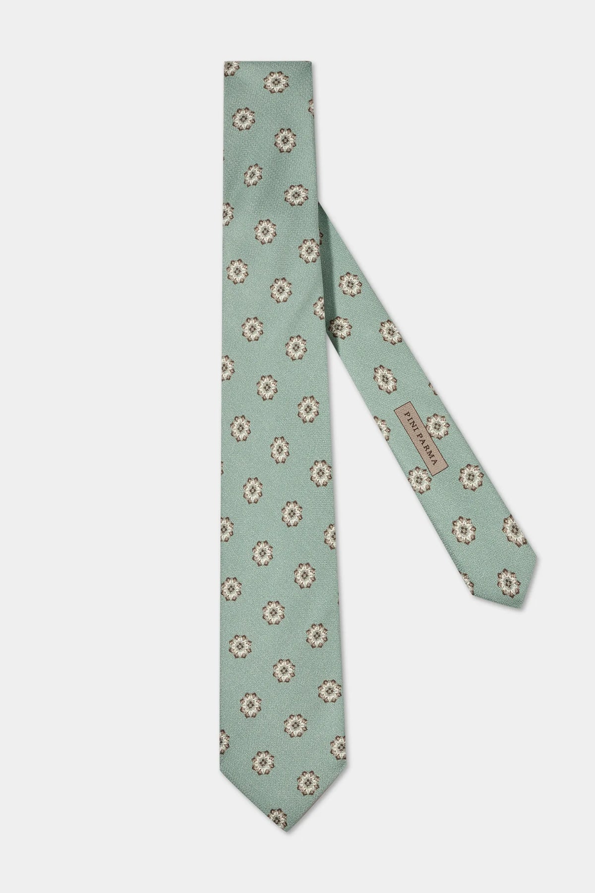 Green floral patterned tie on a light gray background