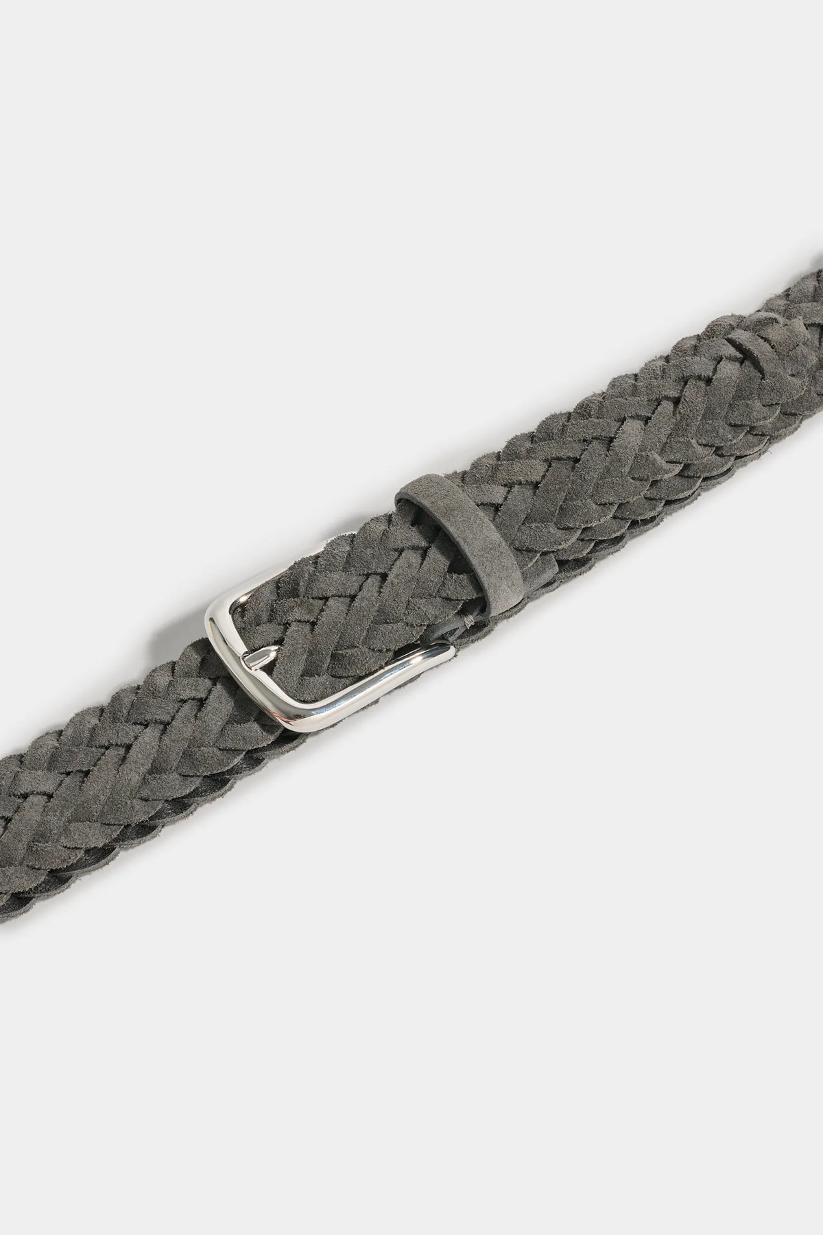 Grey belt with silver buckle on a light background 
