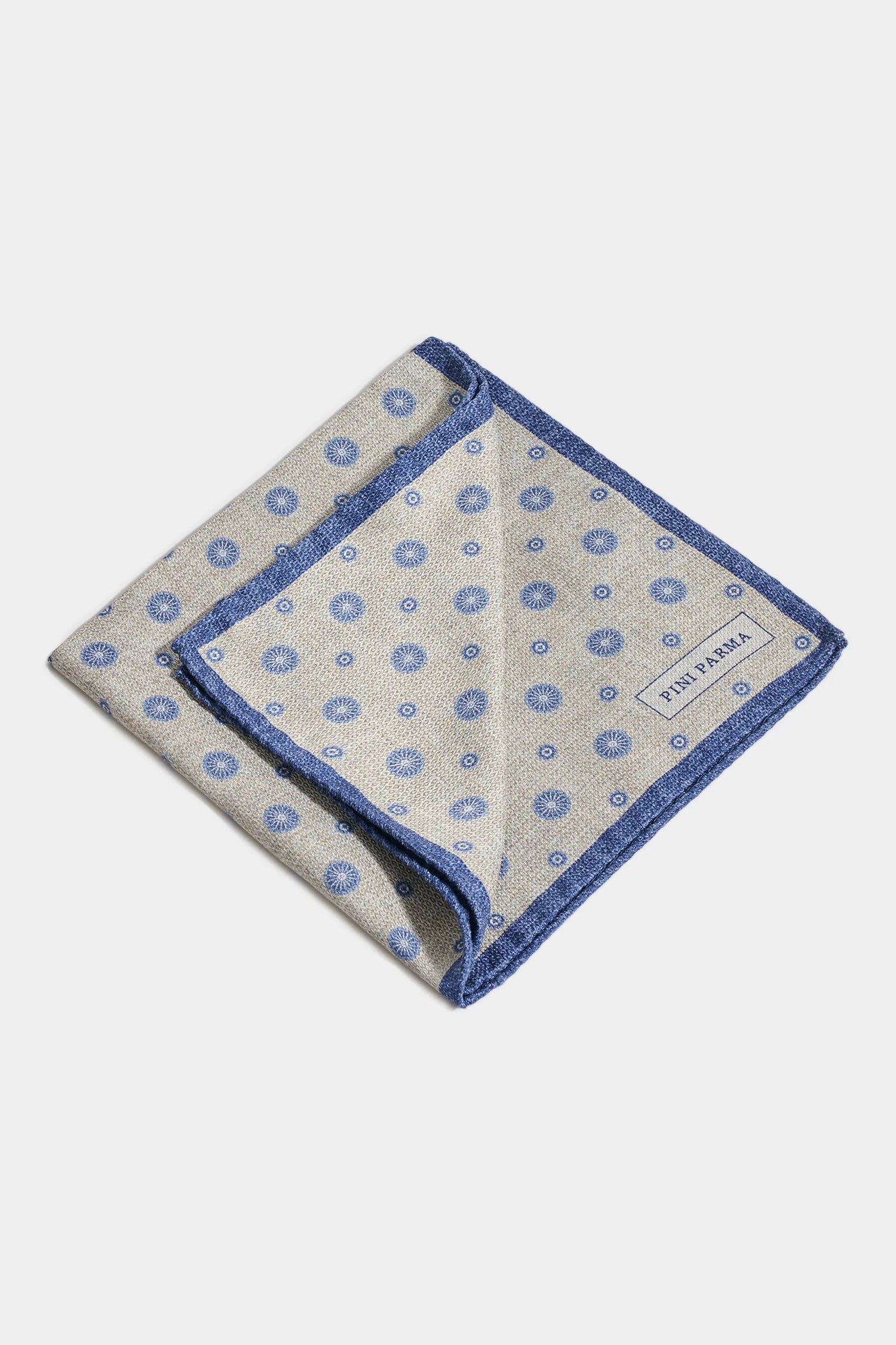 Folded fabric with blue pattern on a white background