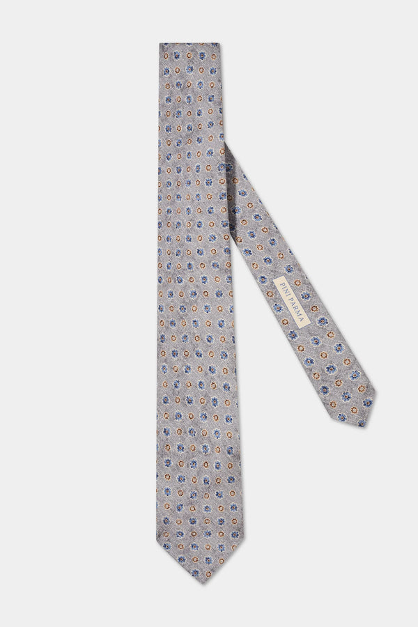 Patterned grey tie on a white background