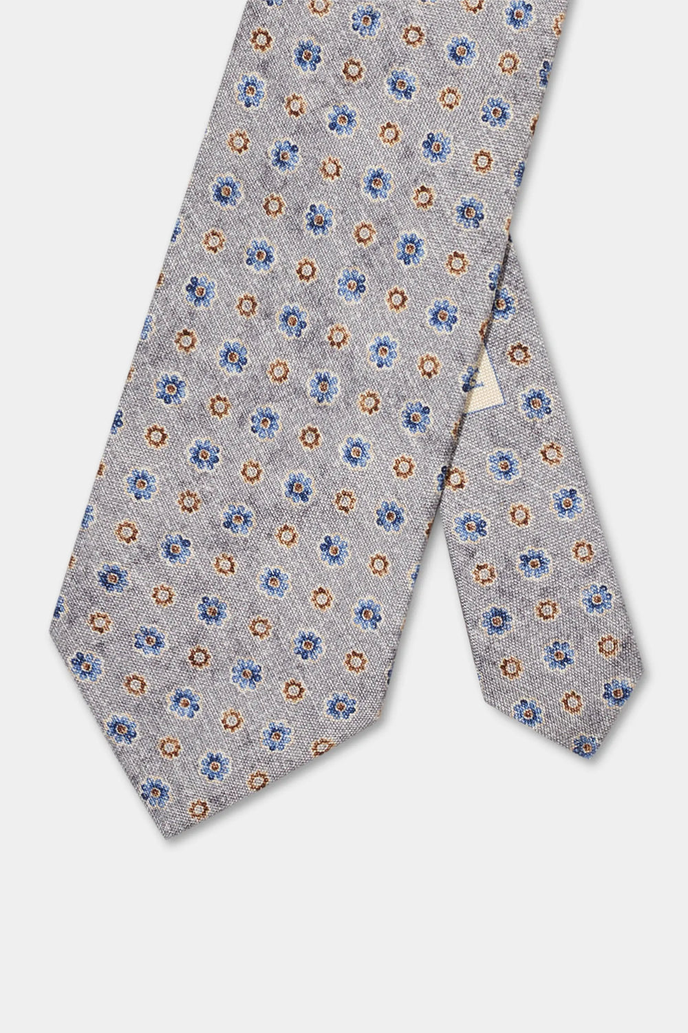 Floral patterned tie on a light gray background