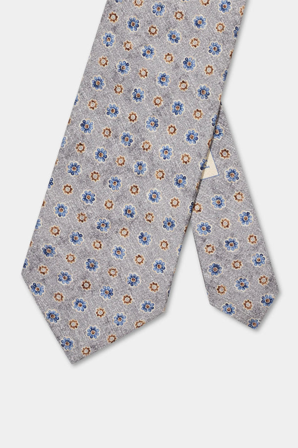 Floral patterned tie on a light gray background