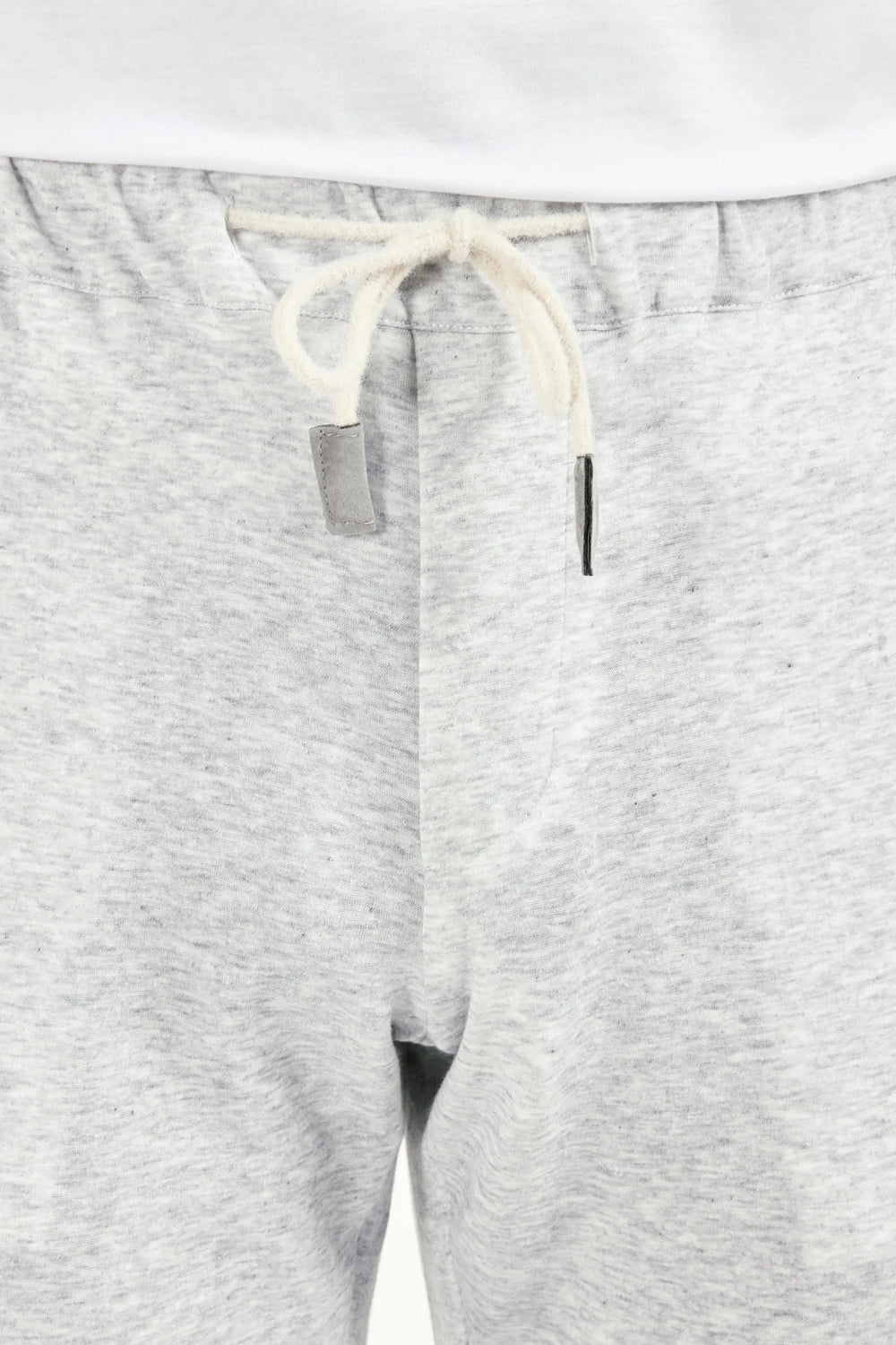 Gray sweatpants with a white drawstring on a light gray background