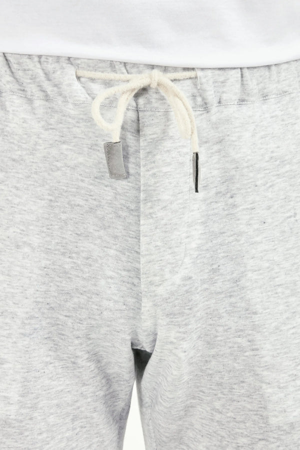 Gray sweatpants with a white drawstring on a light gray background