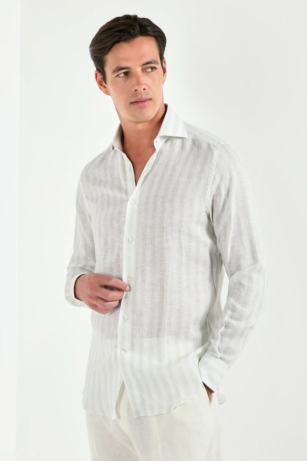 Man wearing a white striped shirt against a white background