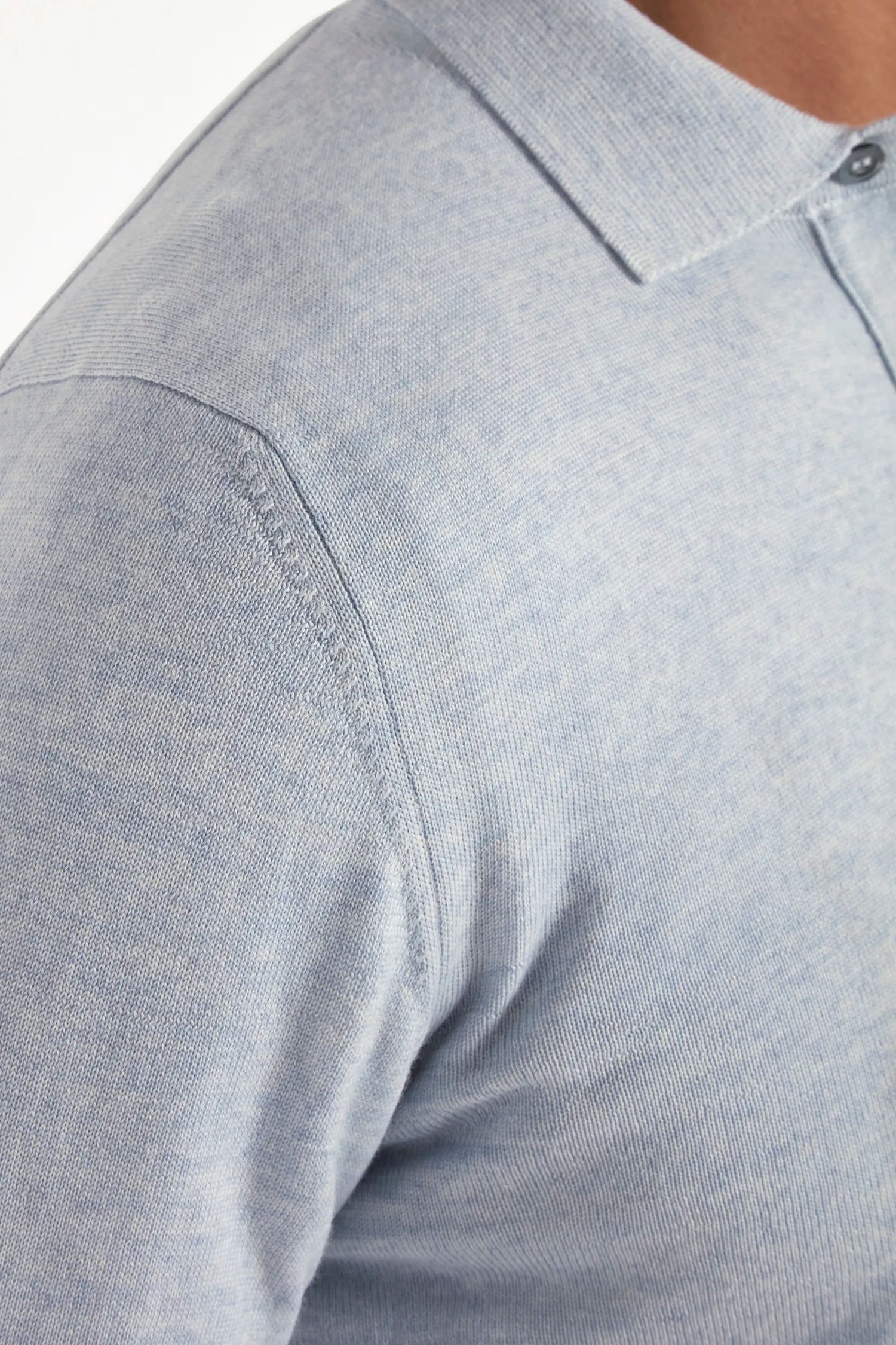 merino wool polo, light blue polo, italian style, made in italy, 100% merino wool polo, lightweight knit polo, luxury knit polo, elegant polo shirt, refined menswear polo, premium italian knitwear, smart casual polo, versatile winter layering, fine merino polo, tailored fit polo, breathable wool polo, soft merino knit polo, upscale polo shirt, italian craftsmanship polo, winter polo layering, polished knit polo