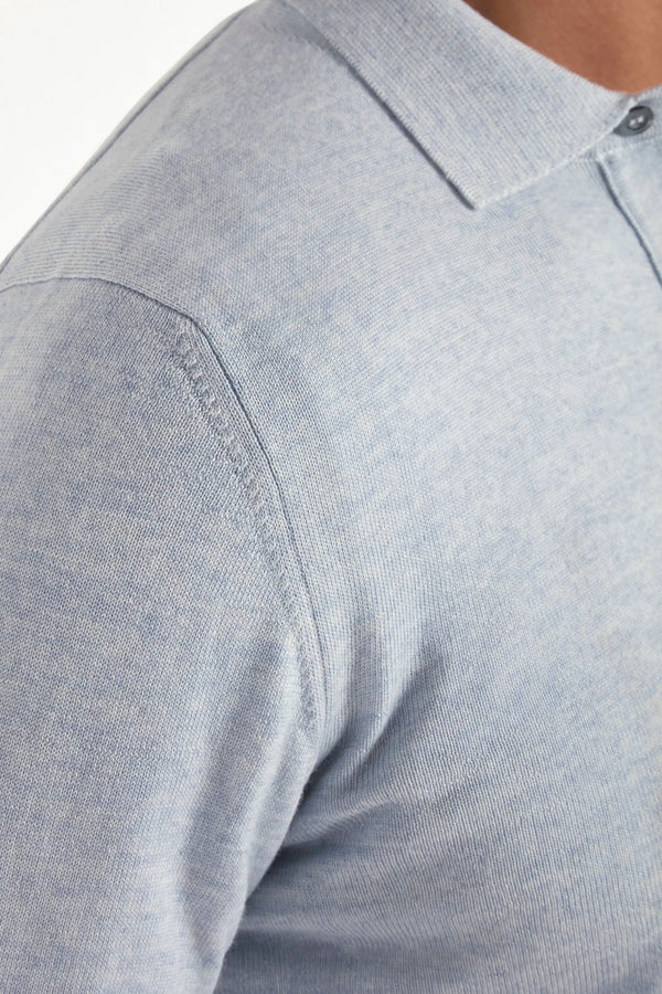 merino wool polo, light blue polo, italian style, made in italy, 100% merino wool polo, lightweight knit polo, luxury knit polo, elegant polo shirt, refined menswear polo, premium italian knitwear, smart casual polo, versatile winter layering, fine merino polo, tailored fit polo, breathable wool polo, soft merino knit polo, upscale polo shirt, italian craftsmanship polo, winter polo layering, polished knit polo