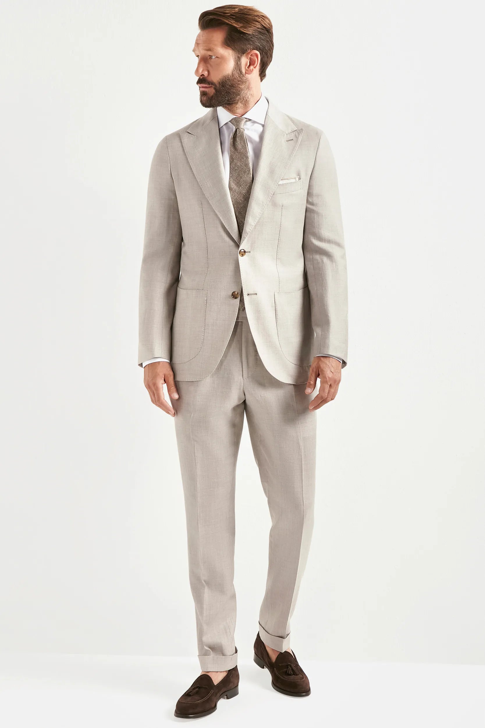 sand men's suit, men's sand suit, italian summer suit, sand wool silk linen suit, luxury men's suit, elegant men's tailoring, refined sand suit, tailored lightweight suit, premium italian suit, sophisticated men's suit, timeless italian tailoring, upscale men's suit, classic sand suit, italian craftsmanship suit, premium wool silk linen suit, refined italian suit