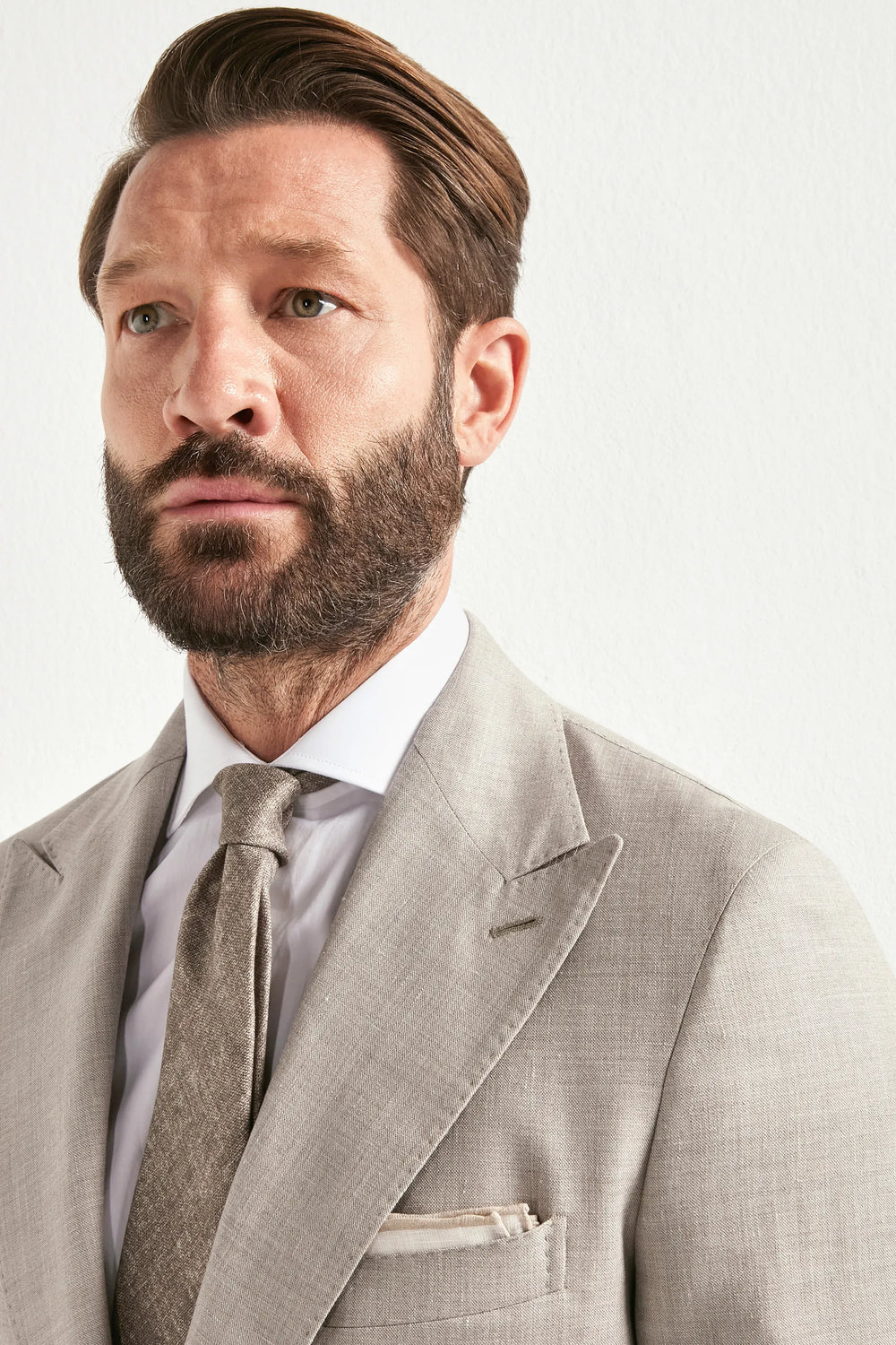 sand men's suit, men's sand suit, italian summer suit, sand wool silk linen suit, luxury men's suit, elegant men's tailoring, refined sand suit, tailored lightweight suit, premium italian suit, sophisticated men's suit, timeless italian tailoring, upscale men's suit, classic sand suit, italian craftsmanship suit, premium wool silk linen suit, refined italian suit