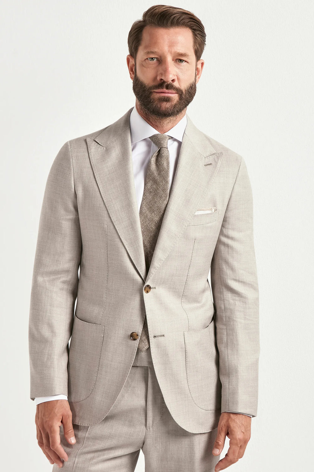 sand men's suit, men's sand suit, italian summer suit, sand wool silk linen suit, luxury men's suit, elegant men's tailoring, refined sand suit, tailored lightweight suit, premium italian suit, sophisticated men's suit, timeless italian tailoring, upscale men's suit, classic sand suit, italian craftsmanship suit, premium wool silk linen suit, refined italian suit