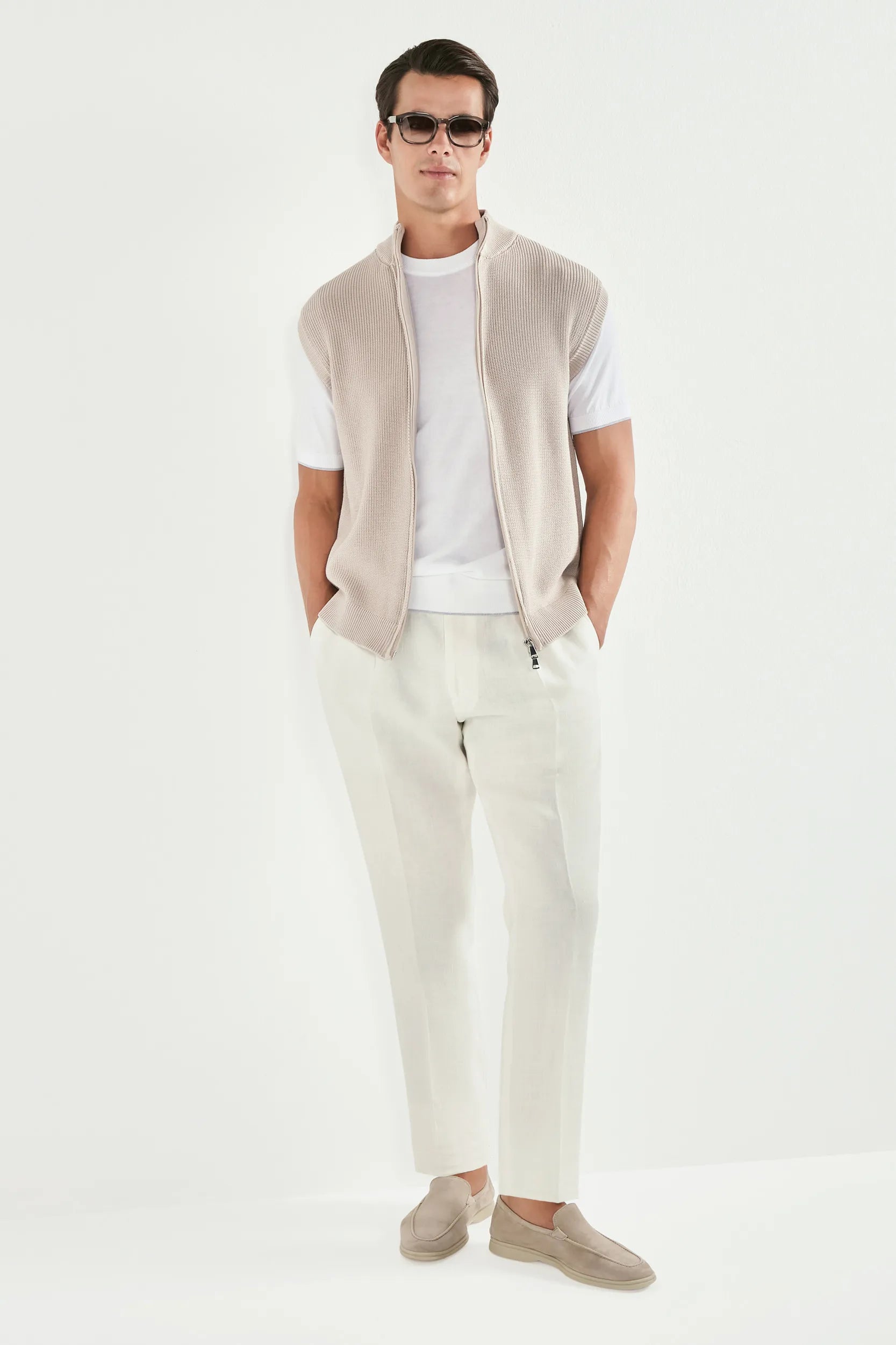 beige knitted vest, men's beige vest, italian knit vest, beige sleeveless knit, luxury men's vest, elegant men's knitwear, refined knitted vest, tailored beige vest, premium italian vest, sophisticated men's knitwear, timeless italian vest, upscale men's sleeveless knit, classic beige vest, italian craftsmanship knit, premium men's knitted vest, refined italian knitwear