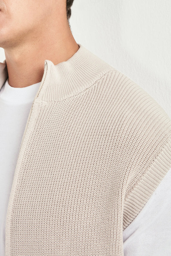 beige knitted vest, men's beige vest, italian knit vest, beige sleeveless knit, luxury men's vest, elegant men's knitwear, refined knitted vest, tailored beige vest, premium italian vest, sophisticated men's knitwear, timeless italian vest, upscale men's sleeveless knit, classic beige vest, italian craftsmanship knit, premium men's knitted vest, refined italian knitwear