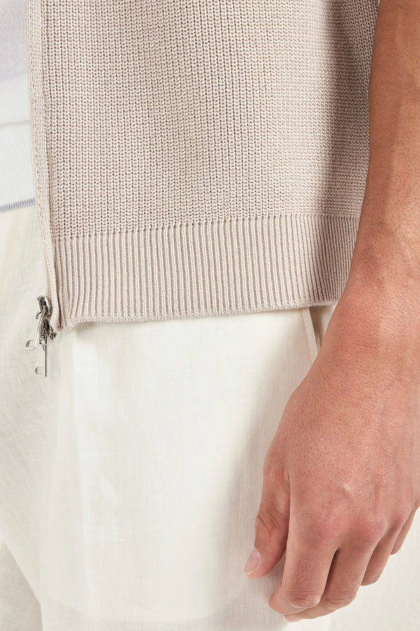 beige knitted vest, men's beige vest, italian knit vest, beige sleeveless knit, luxury men's vest, elegant men's knitwear, refined knitted vest, tailored beige vest, premium italian vest, sophisticated men's knitwear, timeless italian vest, upscale men's sleeveless knit, classic beige vest, italian craftsmanship knit, premium men's knitted vest, refined italian knitwear