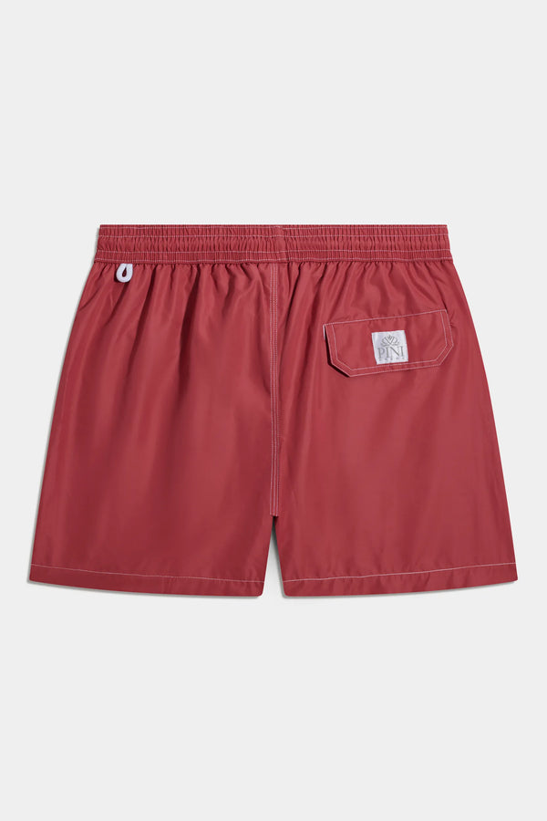 Red shorts with a pocket on a white background