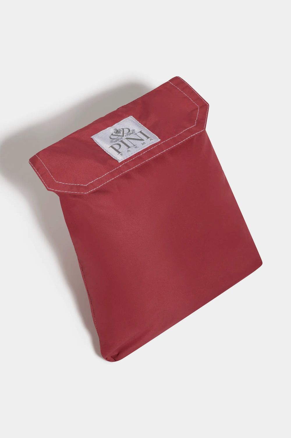 Red pouch with a brand logo on a white background