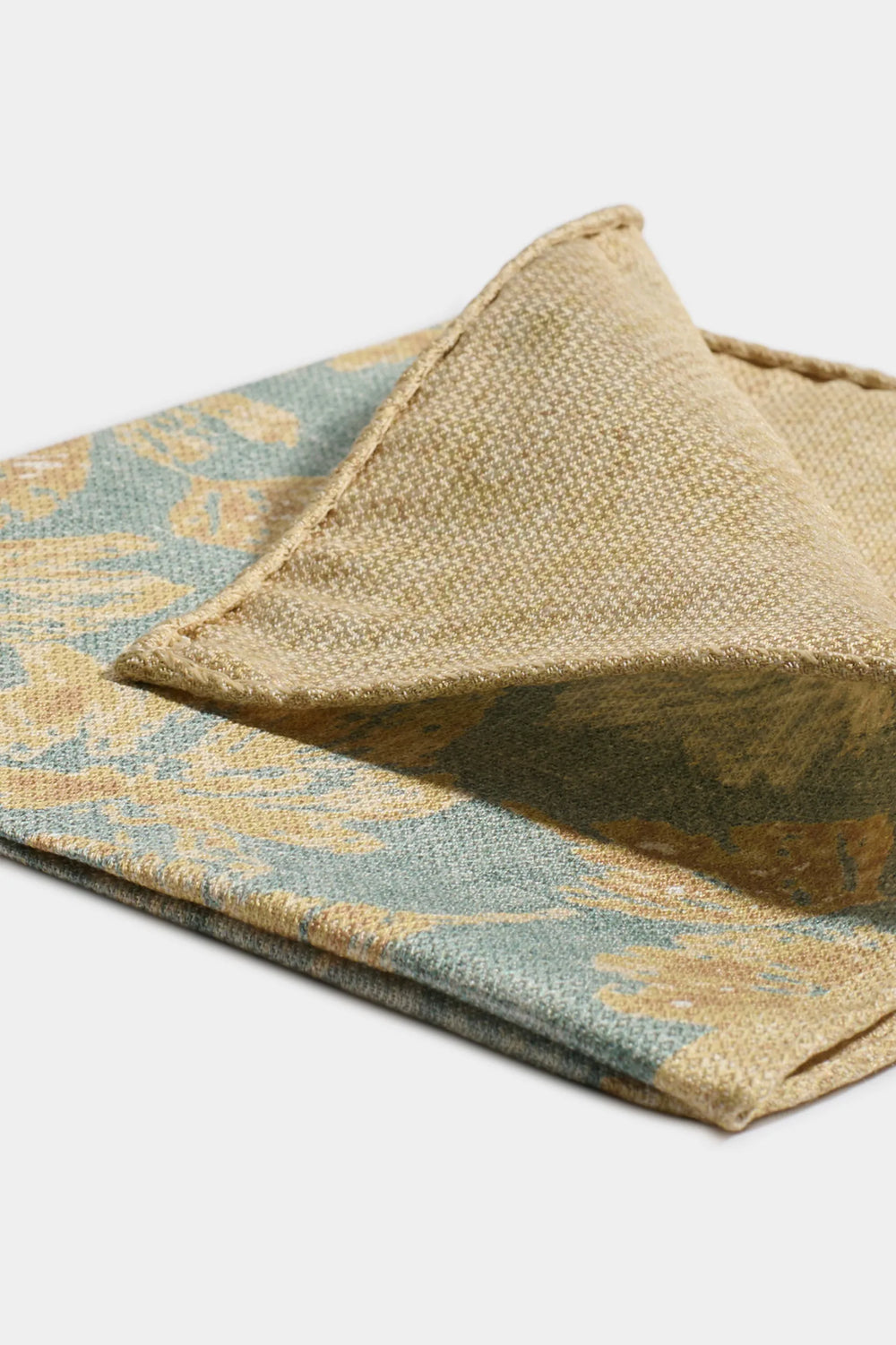 Two woven fabrics with floral patterns on a white background