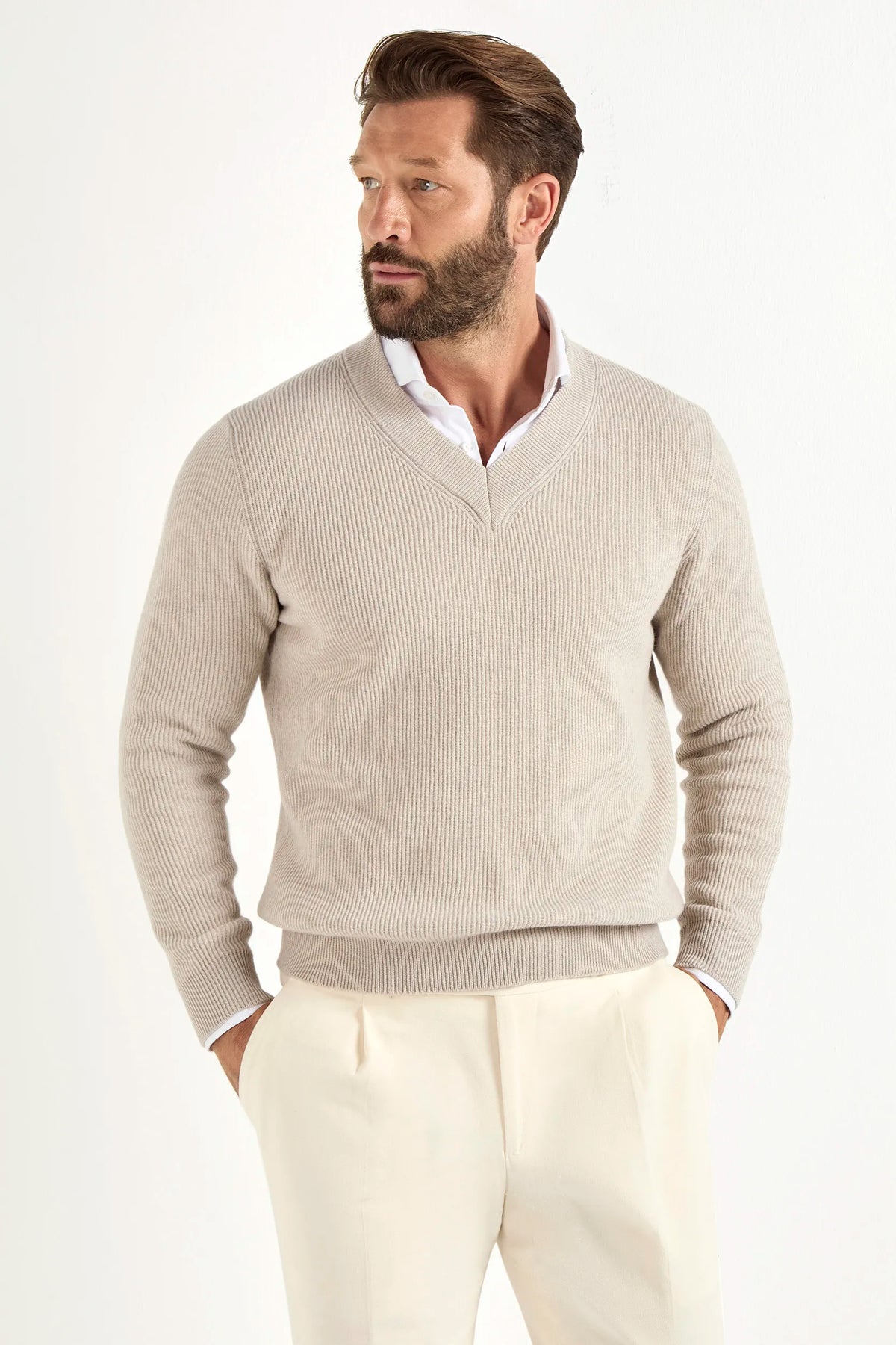 sand ribbed v neck sweater, men's v neck sweater, italian wool sweater, sand wool v neck, luxury men's sweater, elegant men's sweater, refined v neck sweater, tailored sand sweater, premium italian sweater, sophisticated men's knitwear, timeless italian sweater, upscale men's sweater, classic sand v neck, italian craftsmanship sweater, premium men's wool sweater, refined italian v neck sweater