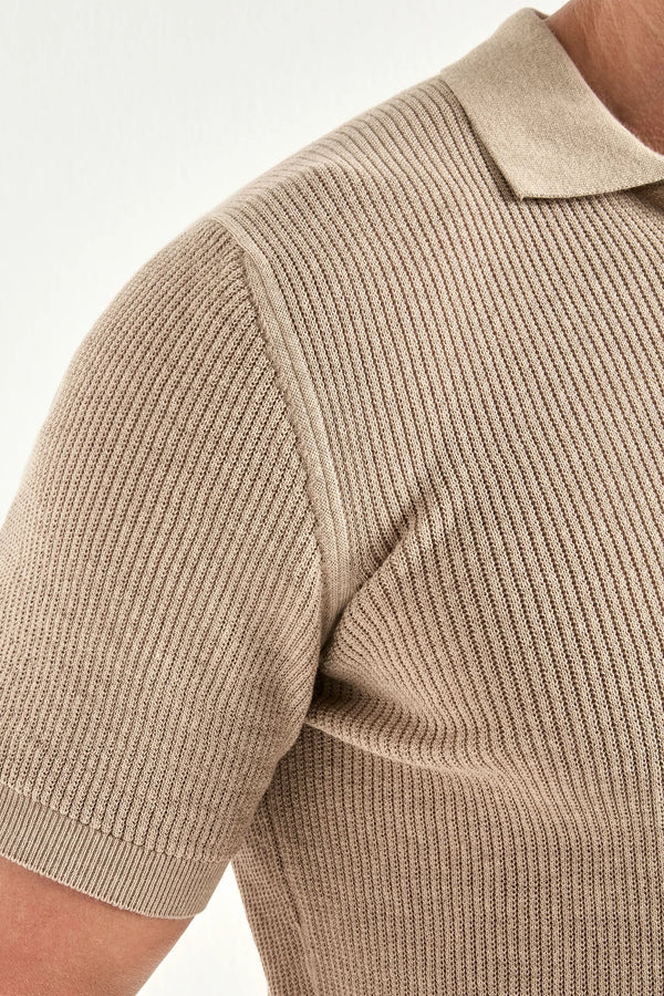 Beige ribbed knit shirt with collar on a white background
