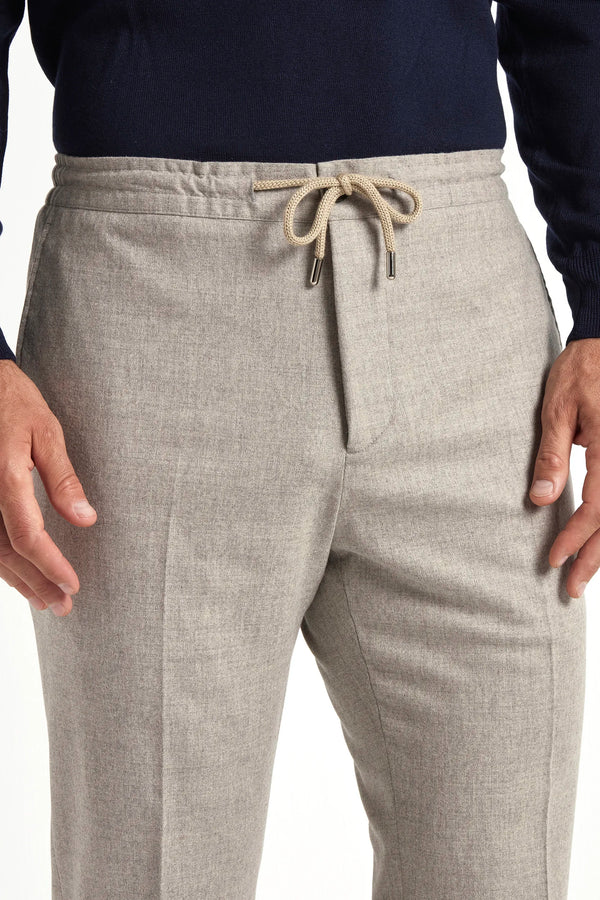 beige flannel drawstring trousers, italian style, made in italy, wool flannel trousers, luxury casual trousers, elegant drawstring pants, tailored flannel trousers, premium italian trousers, versatile wool trousers, refined menswear trousers, winter drawstring trousers, soft flannel trousers, relaxed fit wool trousers, upscale casual trousers, italian craftsmanship trousers, polished drawstring trousers, classic beige flannel trousers, sophisticated winter trousers, comfortable wool trousers, timeless itali
