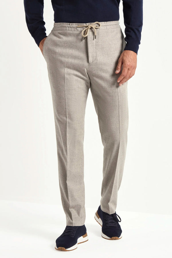 beige flannel drawstring trousers, italian style, made in italy, wool flannel trousers, luxury casual trousers, elegant drawstring pants, tailored flannel trousers, premium italian trousers, versatile wool trousers, refined menswear trousers, winter drawstring trousers, soft flannel trousers, relaxed fit wool trousers, upscale casual trousers, italian craftsmanship trousers, polished drawstring trousers, classic beige flannel trousers, sophisticated winter trousers, comfortable wool trousers, timeless itali
