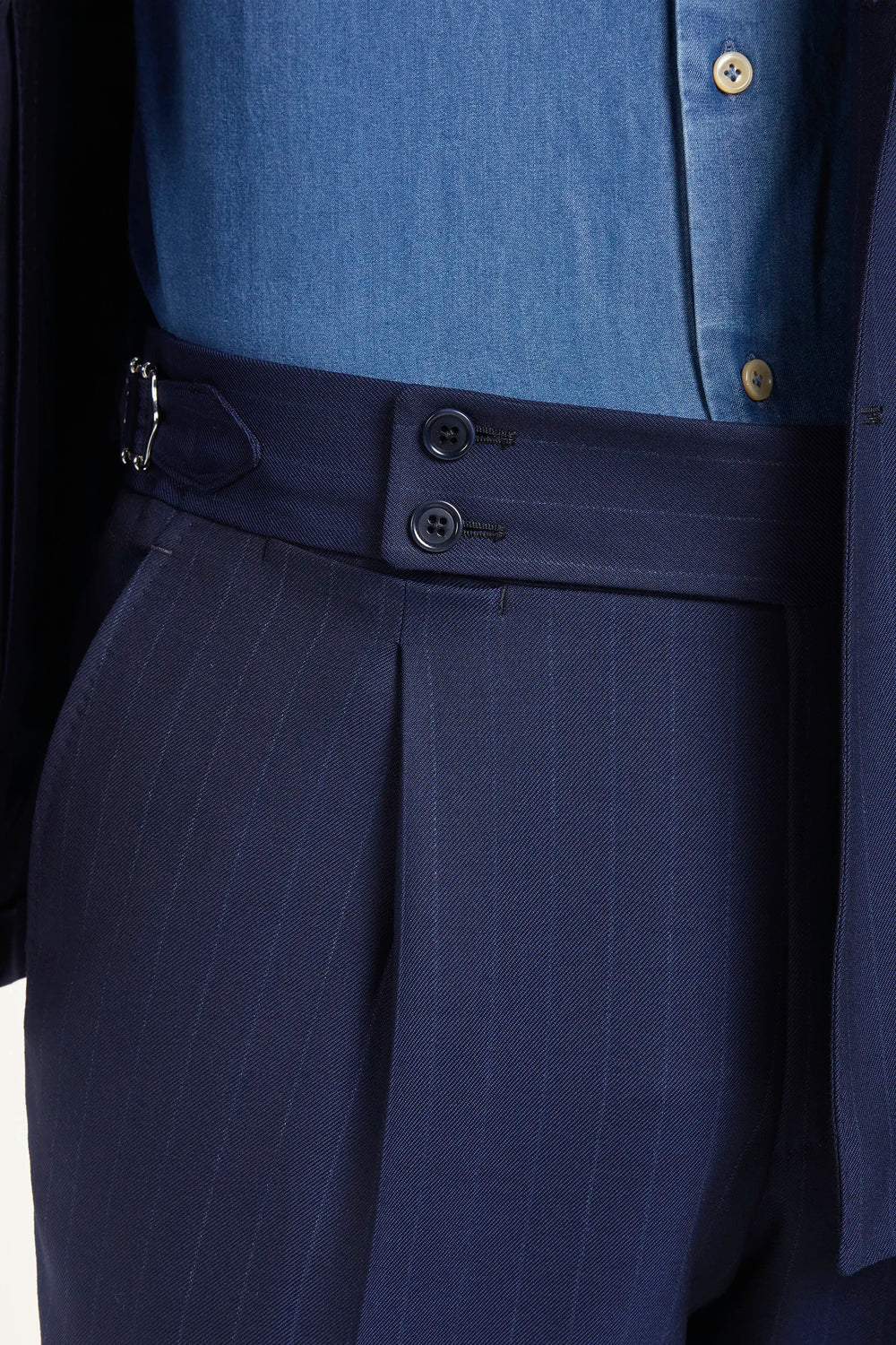 Blue double-breasted striped suit, Italian style, made in Italy, tailored luxury suit, elegant menswear suit, refined formal suit, premium Italian craftsmanship, classic striped suit, sophisticated business suit, smart formal attire, versatile modern suit, polished double-breasted blazer, fine Italian tailoring, upscale menswear suit, timeless Italian suit, refined professional look, sharp tailored suit, luxury office suit, contemporary striped blazer, Italian elegance suit