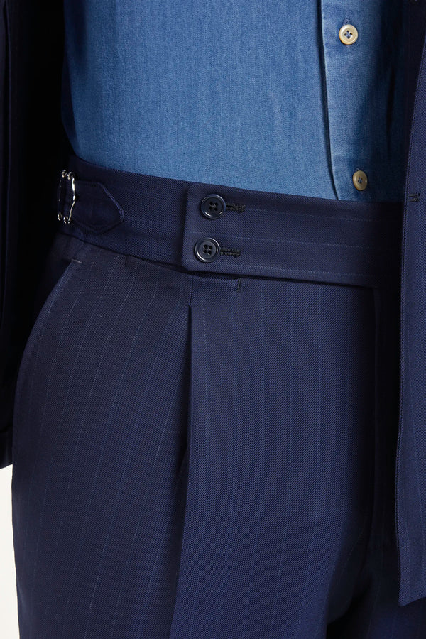 Blue double-breasted striped suit, Italian style, made in Italy, tailored luxury suit, elegant menswear suit, refined formal suit, premium Italian craftsmanship, classic striped suit, sophisticated business suit, smart formal attire, versatile modern suit, polished double-breasted blazer, fine Italian tailoring, upscale menswear suit, timeless Italian suit, refined professional look, sharp tailored suit, luxury office suit, contemporary striped blazer, Italian elegance suit