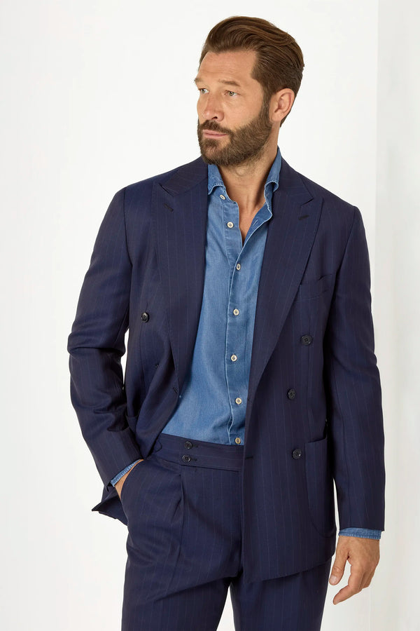 Blue double-breasted striped suit, Italian style, made in Italy, tailored luxury suit, elegant menswear suit, refined formal suit, premium Italian craftsmanship, classic striped suit, sophisticated business suit, smart formal attire, versatile modern suit, polished double-breasted blazer, fine Italian tailoring, upscale menswear suit, timeless Italian suit, refined professional look, sharp tailored suit, luxury office suit, contemporary striped blazer, Italian elegance suit