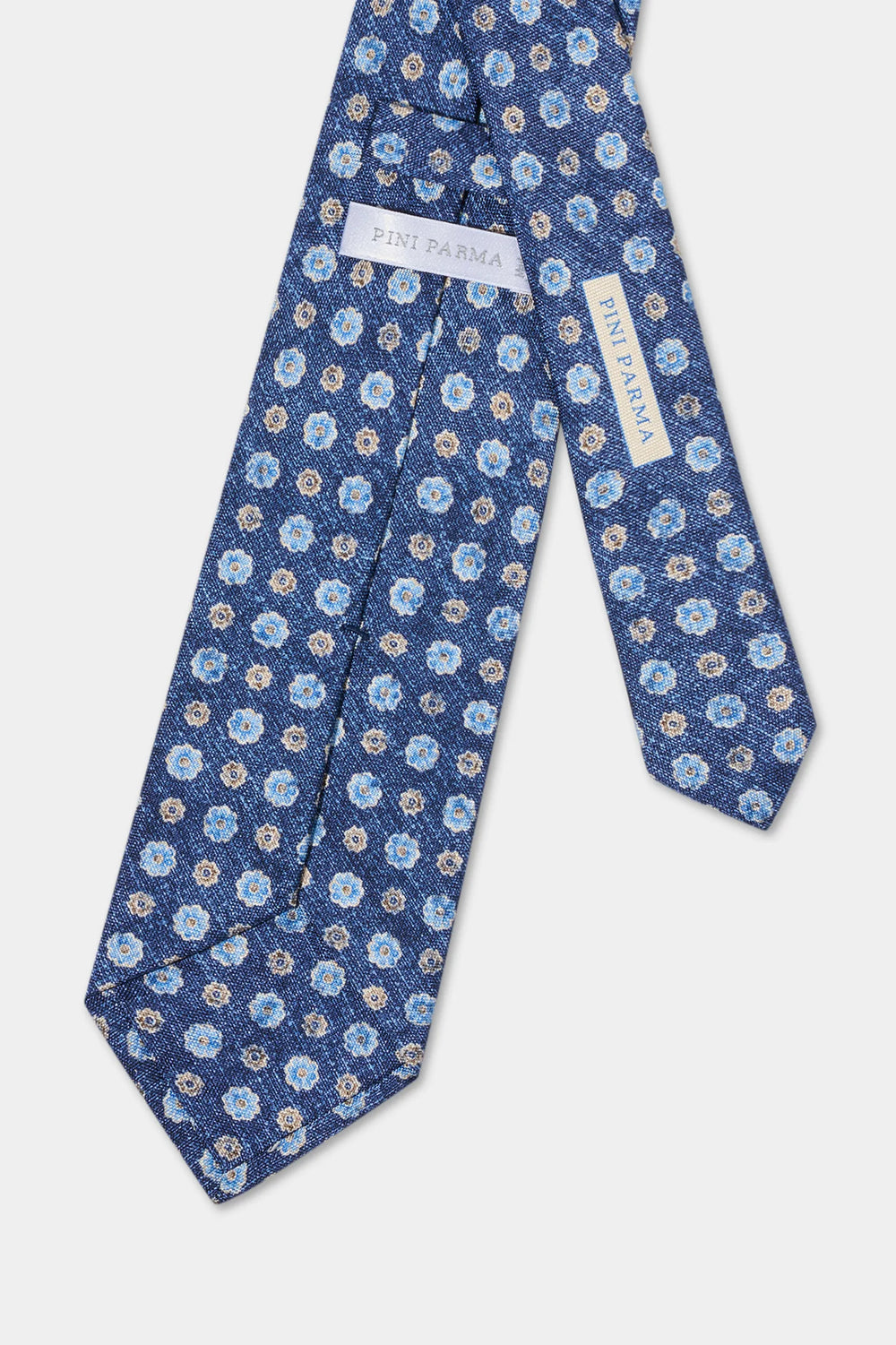 Blue floral patterned tie with branding on a white background
