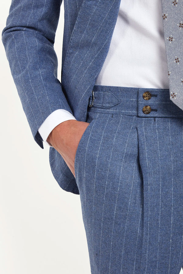 Light blue striped suit, Italian style, made in Italy, tailored luxury suit, elegant menswear suit, refined formalwear, premium Italian craftsmanship, classic striped suit, sophisticated business suit, smart formal attire, versatile modern suit, polished two-piece suit, fine Italian tailoring, upscale menswear suit, timeless Italian suit, refined professional look, sharp tailored suit, luxury office suit, contemporary striped blazer, Italian elegance suit
