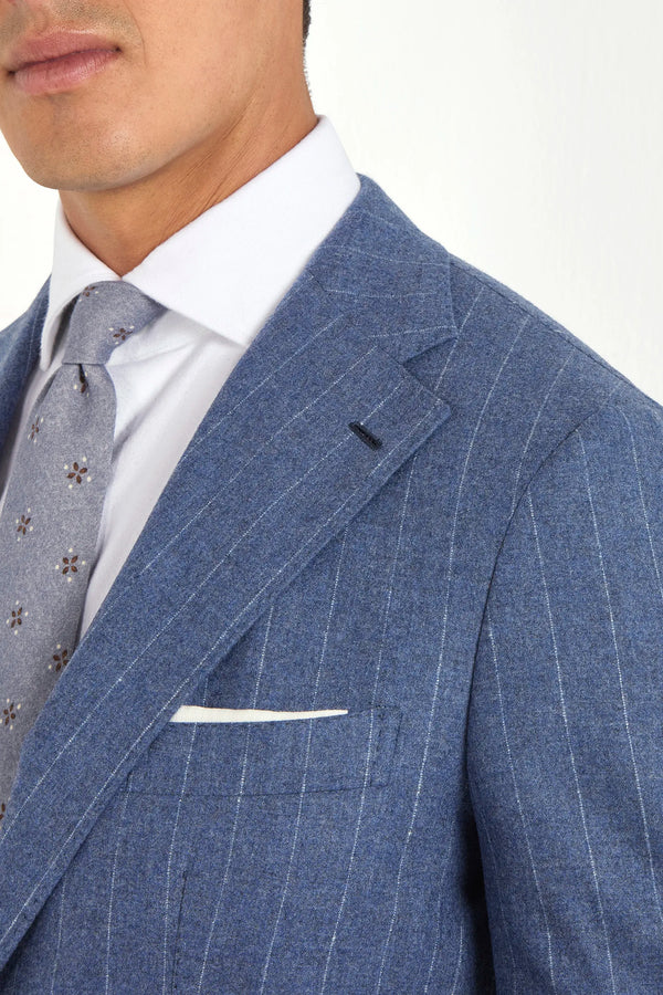 Light blue striped suit, Italian style, made in Italy, tailored luxury suit, elegant menswear suit, refined formalwear, premium Italian craftsmanship, classic striped suit, sophisticated business suit, smart formal attire, versatile modern suit, polished two-piece suit, fine Italian tailoring, upscale menswear suit, timeless Italian suit, refined professional look, sharp tailored suit, luxury office suit, contemporary striped blazer, Italian elegance suit