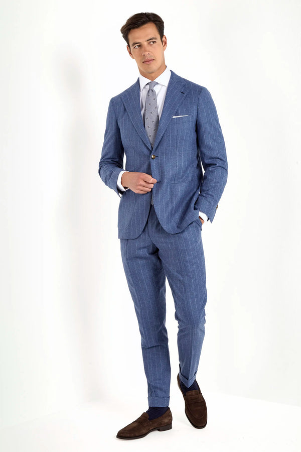 Light blue striped suit, Italian style, made in Italy, tailored luxury suit, elegant menswear suit, refined formalwear, premium Italian craftsmanship, classic striped suit, sophisticated business suit, smart formal attire, versatile modern suit, polished two-piece suit, fine Italian tailoring, upscale menswear suit, timeless Italian suit, refined professional look, sharp tailored suit, luxury office suit, contemporary striped blazer, Italian elegance suit