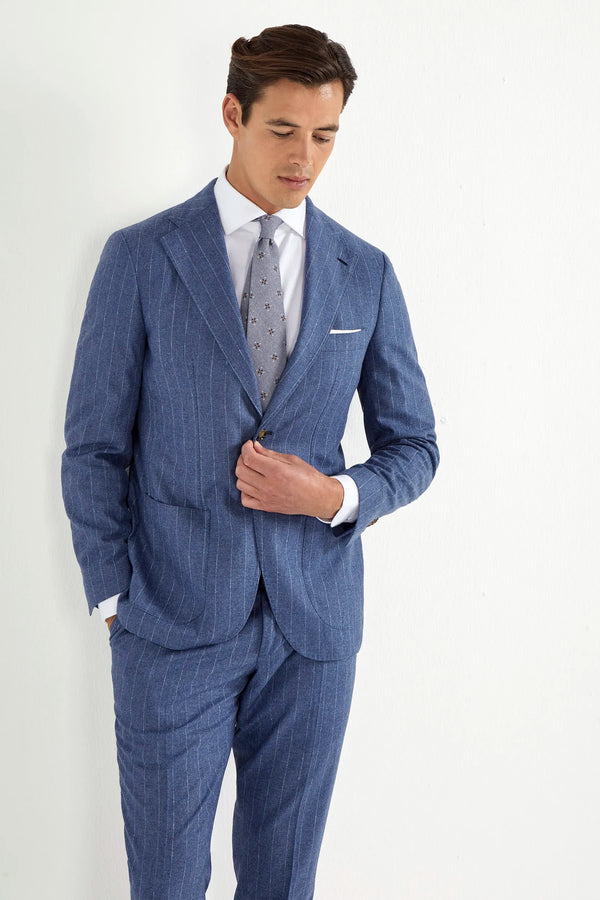 Light blue striped suit, Italian style, made in Italy, tailored luxury suit, elegant menswear suit, refined formalwear, premium Italian craftsmanship, classic striped suit, sophisticated business suit, smart formal attire, versatile modern suit, polished two-piece suit, fine Italian tailoring, upscale menswear suit, timeless Italian suit, refined professional look, sharp tailored suit, luxury office suit, contemporary striped blazer, Italian elegance suit