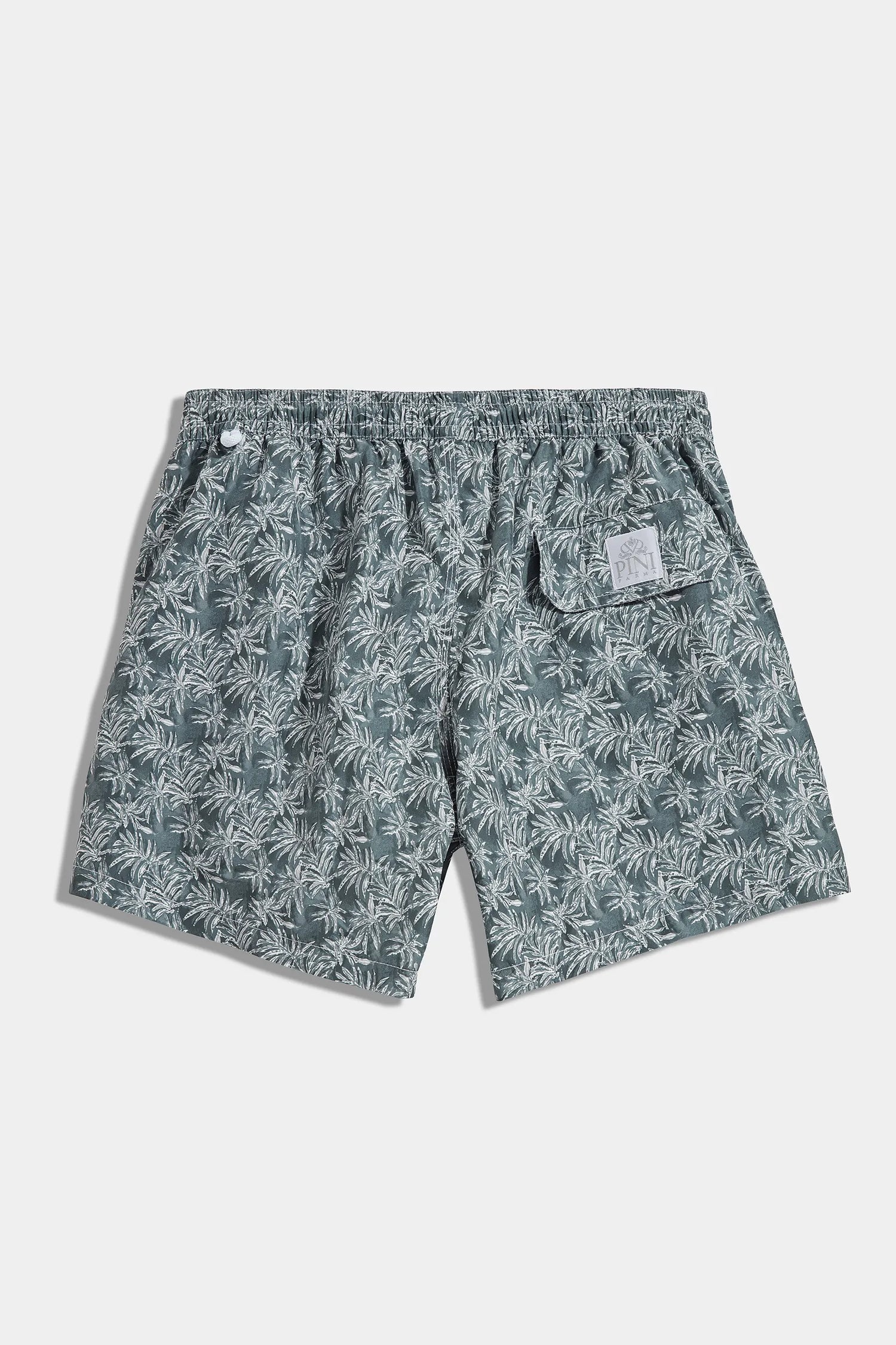 High-end green swim shorts with palm tree pattern, Italian green patterned swimwear, luxury men’s swim shorts, premium palm print swimming trunks, elegant summer shorts, handcrafted Italian swim shorts, stylish green palm tree trunks, short de bain vert à motif palmier fabriqué en Italie, maillot de bain italien haut de gamme, short de bain de luxe pour homme, short de bain élégant, costume da bagno verde con motivo palme fatto in Italia, pantaloncini da mare eleganti italiani.