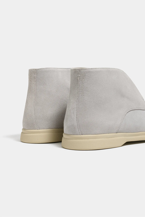 light grey polacchino, men suede polacchino, italian suede loafers, light grey suede loafers, slip-on suede boot, mid-top suede shoe, made in italy polacchino, luxury suede polacchino, elegant suede footwear, refined italian polacchino, premium suede loafers, soft suede ankle boot, versatile suede shoe, handcrafted italian footwear, timeless polacchino design, comfortable suede loafers, upscale suede shoe, italian craftsmanship polacchino, casual luxury footwear, classic light grey suede loafer